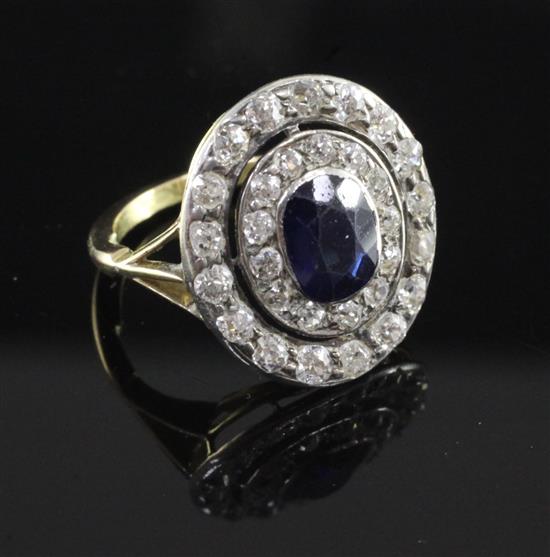 A 1940s gold, synthetic? sapphire and diamond cluster ring, size G.